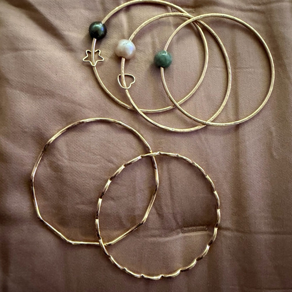 Gold filled set of 5 bangles made in Hawaii.